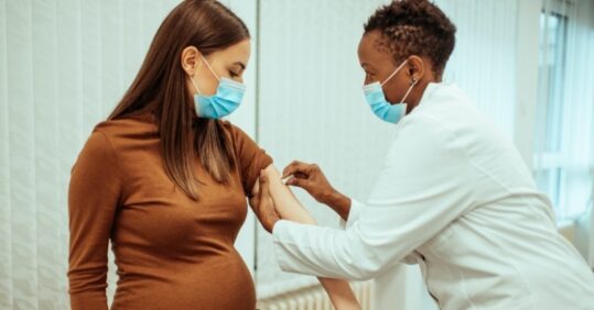 pregnant woman getting vaccination