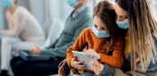 Face masks should still be worn in GP practices, says NHS England